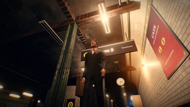 Looking up at the commuter in a dark suit on the platform.